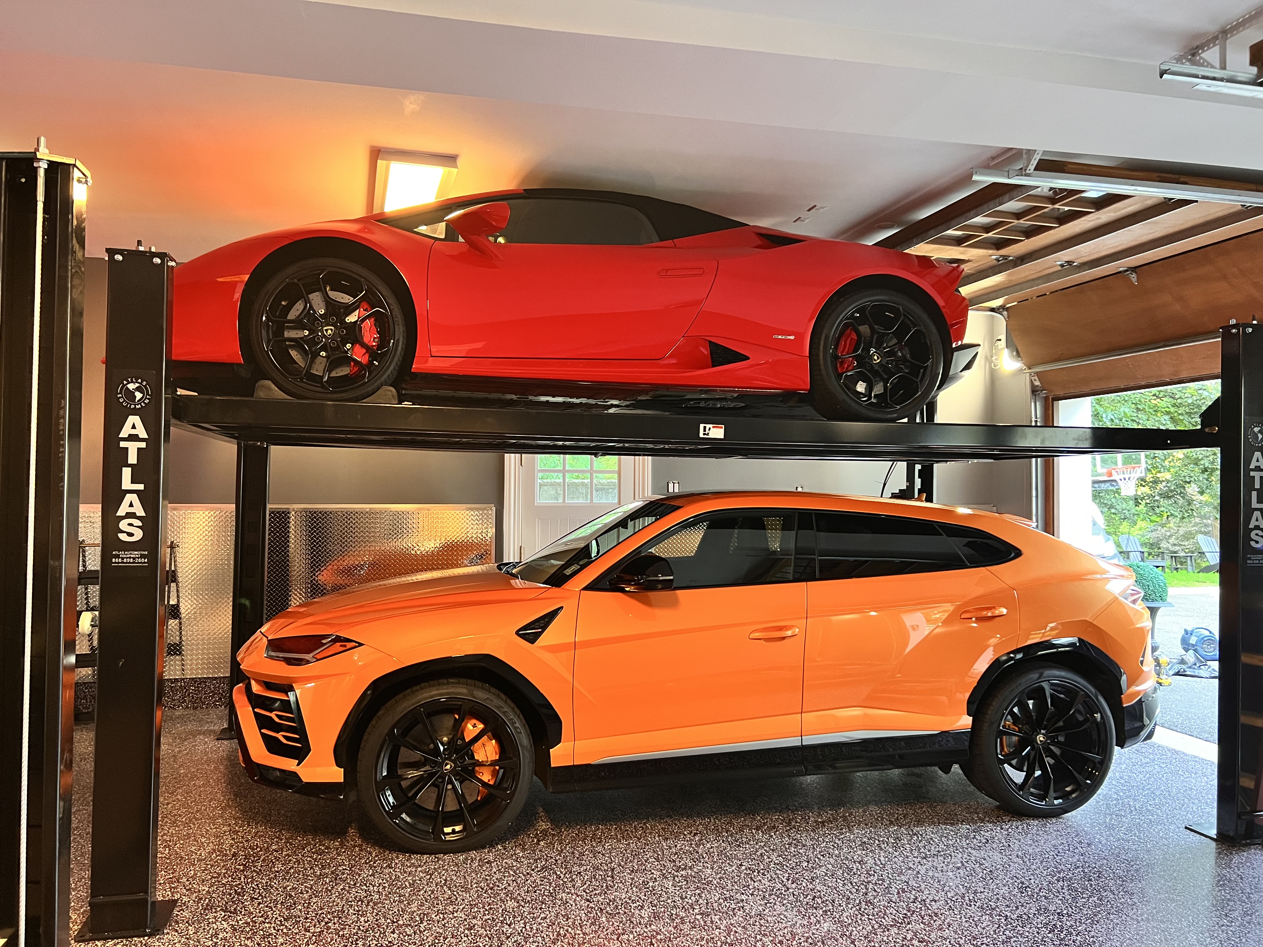 High-end garage with Lamborghini and Ferrari