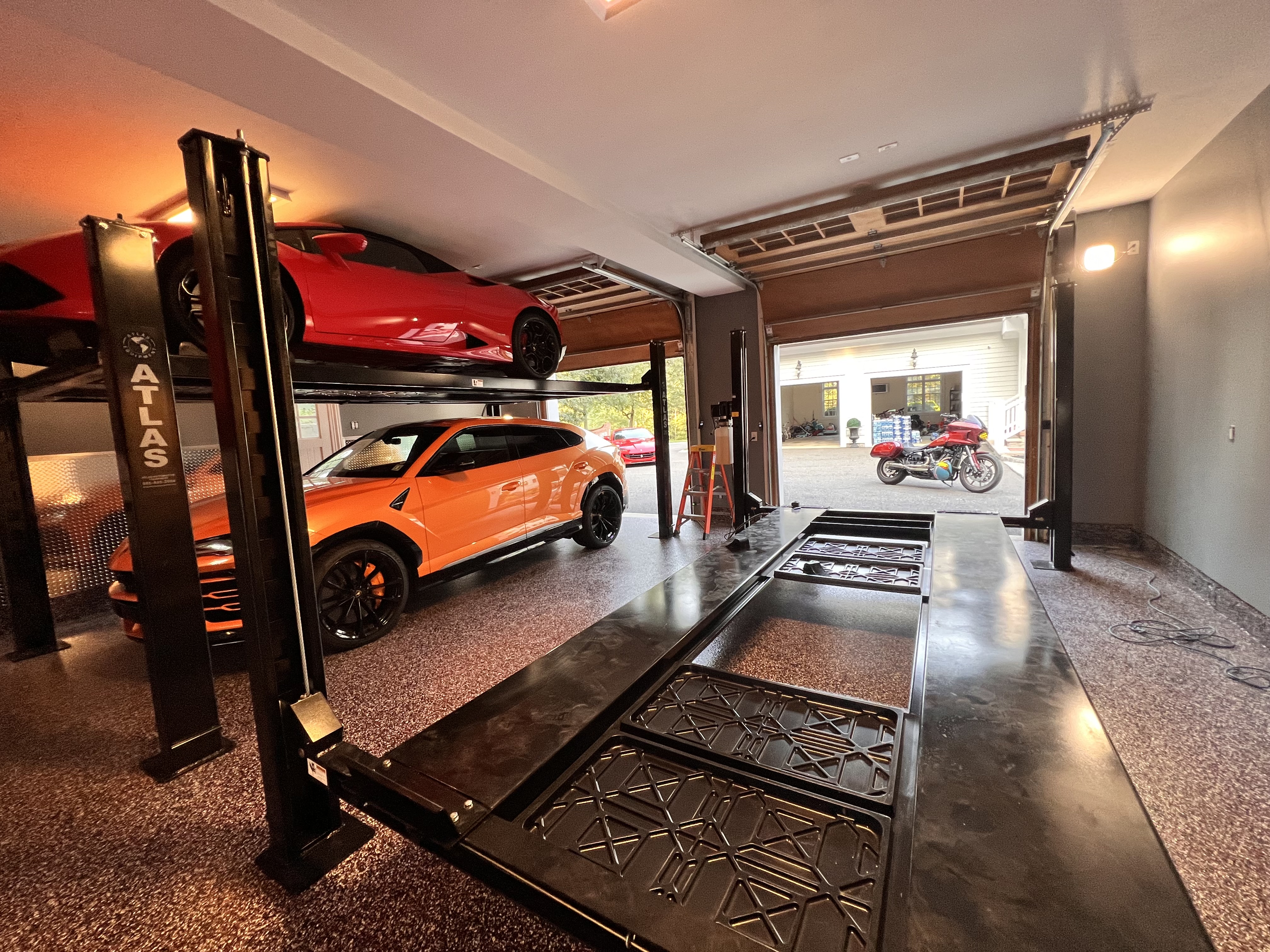 Luxury garage with car lift — door installation
